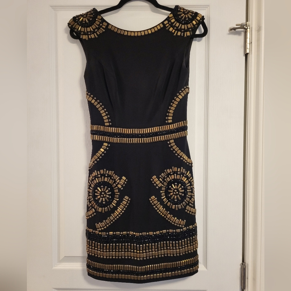 Talitha black cocktail dress with gold beading in Size 2.